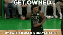 a basketball player wearing a celtics jersey is dancing on the court