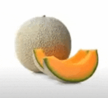 a cantaloupe is sitting next to a slice of cantaloupe on a white surface .