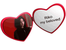 a heart shaped mirror with riko my beloved on it