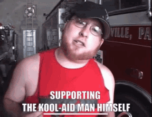 a man standing in front of a fire truck with the words supporting the kool-aid man himself below him