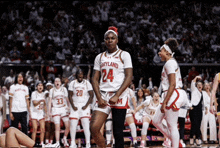 a female basketball player wearing a jersey that says maryland on it