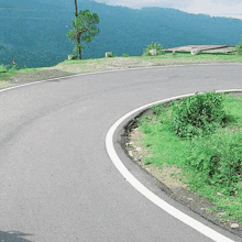 a curvy road with a white line on it