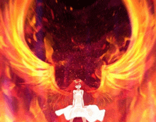 a girl in a white dress with red hair is surrounded by flames