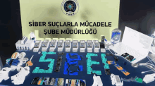 a table with a sign that says ' siber suçlarla mücadele ' on it