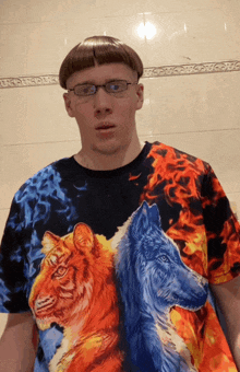 a man wearing a shirt with a tiger and wolf on it