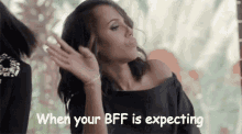 a woman is blowing a kiss with the words `` when your bff is expecting '' .