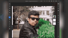 a man wearing sunglasses and a leather jacket is being edited in a photo editing program