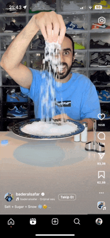 a man in a blue shirt is pouring salt into his mouth