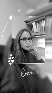 a black and white photo of a woman with glasses and the word love