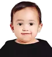 a baby is wearing a black shirt and smiling for the camera