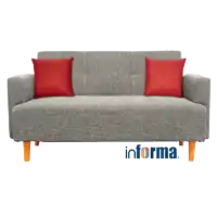 a grey couch with two red pillows and the word informa on it