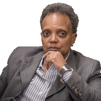 a woman in a suit and striped shirt is sitting in a chair with her hand on her chin