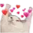 a blurred image of a cat with hearts coming out of its eyes .