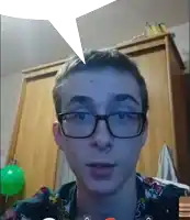 a young man wearing glasses has a speech bubble coming out of his head