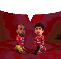 a man in a red ferrari uniform is standing next to a man in a red ferrari uniform