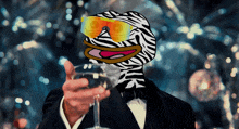 a man in a tuxedo holds a glass of wine