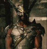 a man is wearing a helmet with wings and a sword