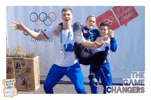 a group of young men are posing for a picture in front of a sign that says the game changers