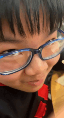 a close up of a person wearing glasses