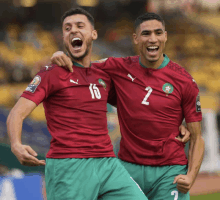 two soccer players wearing jerseys with the number 2 on them