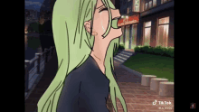 a girl with green hair is crying in front of a building ..