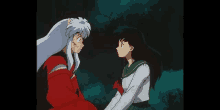 a boy and a girl are looking at each other in a dark forest