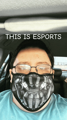 a man wearing glasses and a face mask with the words this is esports above him