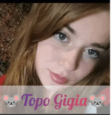 a close up of a woman 's face with topo gigia written on the bottom