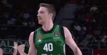 a basketball player wearing a green jersey with the number 40