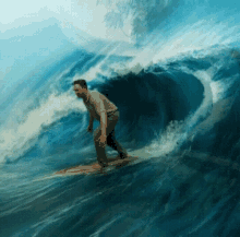 a man riding a wave on a surfboard