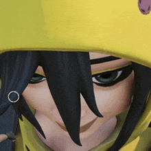 a close up of a person 's face with a yellow hoodie on