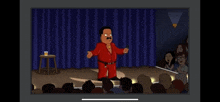 a man in a red suit is standing on a stage in front of a crowd of people