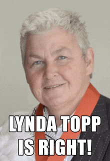 a man with a red sash around his neck and the words lynda topp is right below him