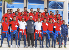 a group of men posing for a picture with one wearing a name tag that says ' ethiopia '