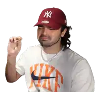 a man wearing a ny yankees hat and a white nike shirt