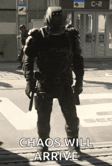 a black and white photo of a soldier with the words " chaos will arrive " on the bottom