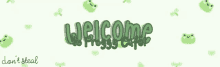 a banner with green frogs and the words `` welcome '' on it .