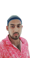 a man wearing a headband and a pink shirt with b612 written on the bottom