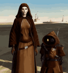 a woman in a brown robe stands next to a small robot with a hood