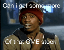 a man wearing a red hat is crying with the words " can i get some more of that gme stock "