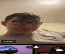 a young man wearing glasses is on a video call with another person