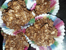 a bunch of cupcake liners filled with chocolate covered rice krispie treats