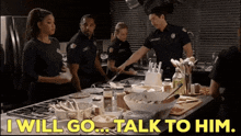 a group of firefighters standing around a kitchen counter with the words " i will go talk to him " written on the bottom