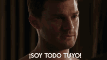 a man without a shirt says " soy todo tuyo "