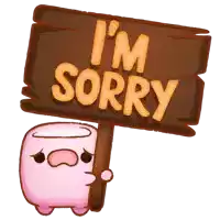 a sign that says i 'm sorry is being held by a pink marshmallow