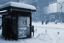 a snowy city street with a sign that says tech your business