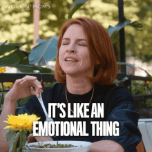 a woman is sitting at a table with a bowl of food and the words " it 's like an emotional thing " above her