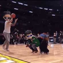 a group of people on a basketball court with a sign that says verizon