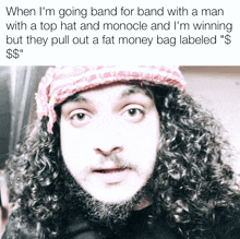 a man with curly hair and a beard is wearing a red bandana