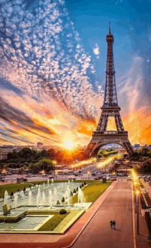 the eiffel tower is surrounded by fountains at sunset